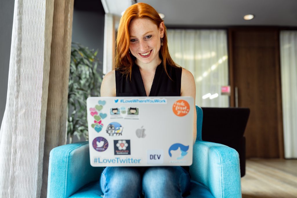 Smiling websockets webrtc developer with laptop
