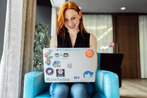 Smiling websockets webrtc developer with laptop