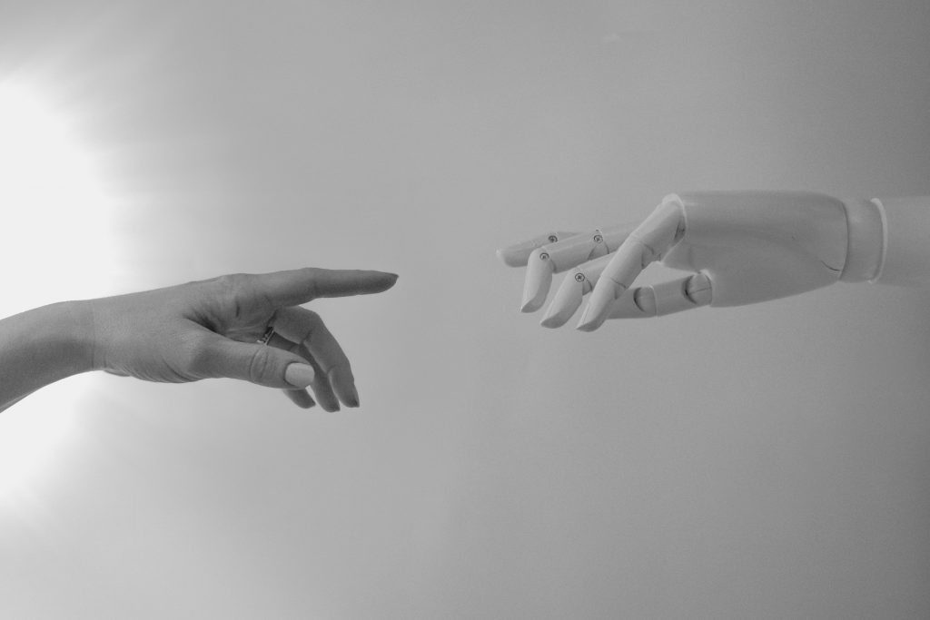 The inexorable rise of the supercharged developer - ai touching hands with a human